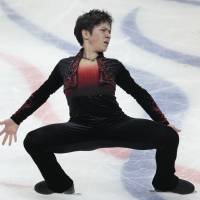 Shoma Uno, seen here performing a cantilever at the Cup of Russia on Saturday, has analysts believing he will be contending for a medal at the world championships this season. | AP