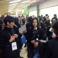 Reigning junior world champion Marin Honda (center) is seen during Friday\'s draw for the Japan Junior Championships in Sapporo. | JACK GALLAGHER