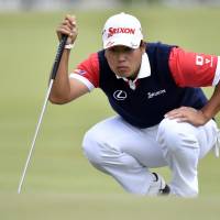 Japan\'s Hideki Matsuyama lines up a putt at the World Cup of Golf in Melbourne, Australia, on Sunday. | AP