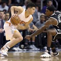 Shooting guard Devin Booker, a second-year pro, is averaging 20.2 points a game for the Suns. | AP