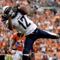 San Diego wide receiver Travis Benjamin (12), seen in action against the Denver Broncos on Sunday, and his Chargers teammates may be playing their final NFL season in the sunny California city. A move to Los Angeles could materialize. | AP