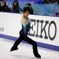 Olympic champion Yuzuru Hanyu glides across the ice during the men\'s free skate at the NHK Trophy on Saturday in Sapporo. Hanyu claimed the top prize with 301.47 points. | REUTERS