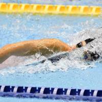 Rikako Ikee swims to victory in the women\'s 50-meter freestyle at the Asian swimming championships on Friday at Tokyo Tatsumi International Swimming Center. | KYODO