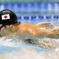 Masato Sakai  swims to victory in the men\'s 200-meter butterfly at the Asian swimming championships on Saturday at Tatsumi International Swimming Center. | KYODO