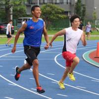 Japanese track phenom Abdul Hakim Sani Brown (left), seen in a file photo, is one of the most notable biracial athletes in the nation. | KAZ NAGATSUKA