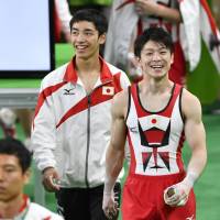 Kohei Uchimura (right) has won the all-around title at the last six world gymnastics championships and is a two-time Olympic champion in the event. | KYODO
