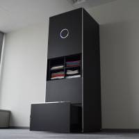 The Seven Dreamers Laboratories Inc. Laundroid robot prototype stands at the company\'s headquarters in Tokyo on Nov. 21. | BLOOMBERG