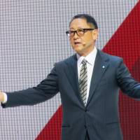 Toyota Motor Corp. President Akio Toyoda speaks during the Paris Motor Show in September. | KYODO