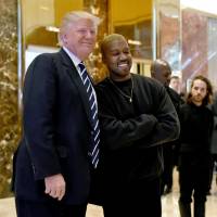 Life of Donald: Musician Kanye West and President-elect Donald Trump speak with the press after their meeting at Trump Tower in New York on Tuesday. Kanye West meets with Donald Trump to discuss 'multicultural issues'
