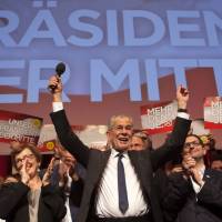 Austrian Presidential candidate Alexander Van der Bellen celebrates with supporters at a post-election event in Vienna on Sunday. Austrian far-right candidate Norbert Hofer on Sunday congratulated his opponent in presidential elections after projections indicated that he had lost. Austrians in runoff roundly reject far-right presidential candidate