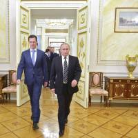 Russian President Vladimir Putin and Syrian President Bashar Assad meet at the Kremlin in Moscow on Oct. 20, 2015. | REUTERS