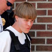 Police lead Charleston church shooter Dylann Roof into the courthouse in Shelby, North Carolina, on June 18, 2015. | REUTERS