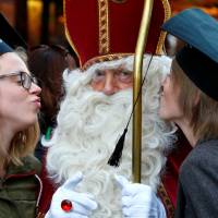 St. Nicholas poses with students Saturday in Brussels. | REUTERS