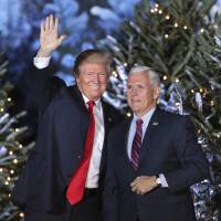 U.S. President-elect Donald Trump takes the stage with Vice President-elect Mike Pence during a rally in Orlando, Florida, on Friday night. | AP