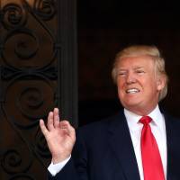 U.S. President-elect Donald Trump talks with the media at Mar-a-Lago estate where Trump attends meetings, in Palm Beach, Florida, Wednesday. | REUTERS