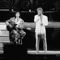 George Michael and Andrew Ridgeley of the British duo Wham! perform in Beijing on April 7, 1985. | AP