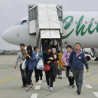 Passengers flying from Shanghai arrive at Ibaraki Airport in November 2015. | KYODO