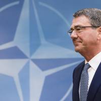 U.S. Defense Secretary Ash Carter arrives for a meeting of the North Atlantic Council Defense Ministers session at NATO headquarters in Brussels in this Oct. 26 file photo. Carter said Monday that the United States is satisfied with Japan\'s contribution to the alliance between the two countries. | AP