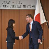 U.S. Defense Secretary Ash Carter is welcomed by Defence Minister Tomomi Inada prior to their talks at the Defence Ministry in Tokyo on Wednesday. On Japan stop of Asia tour, Carter reassures Inada over Trump fears