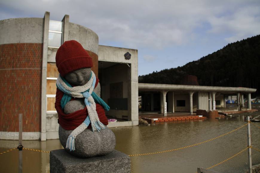 A stone statue stands near tsunami-hit Okawa Elementary School in Ishinomaki, Miyagi Prefecture, in March 2012. The education ministry plans to make classes on disaster response a mandatory subject for university students aiming to become teachers. Disaster preparation course to be mandatory for aspiring teachers
