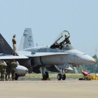 A U.S. military F/A-18 fighter jet, the same type of aircraft that crashed into waters off Kochi Prefecture on Wednesday, is seen at Air Self-Defense Force Nyutabaru Airbase in Miyazaki Prefecture in 2013. | KYODO
