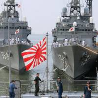 Three Japanese Maritime Self-Defense Force warships &#8212; the Setoyuki, left, the Asagiri, right, and the Kashima &#8212; arrive at the Port of Manila on a training mission on Oct. 13, 2014. | KYODO