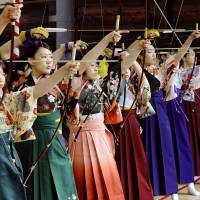 Women who are or will turn 20 years old as of April 1 take part in an archery event at the Sanjusangendo, a Buddhist temple in Kyoto, on Jan. 17, 2016. | KYODO