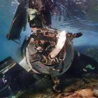 A U.S. Marine Corps MV-22 Osprey is submerged off Nago, Okinawa Prefecture, on Wednesday after ditching Tuesday evening. Senior U.S. official praises Osprey pilot's decision to ditch