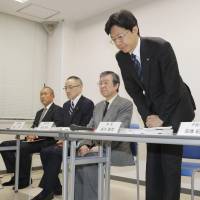 Koji Tanigawa apologizes Tuesday at a news conference in Tokyo. | KYODO