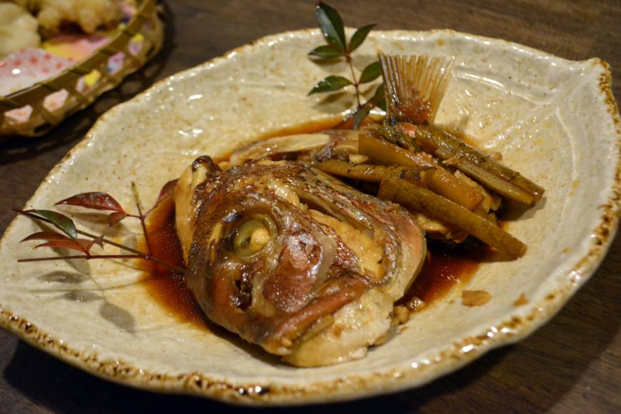 Wa Bistro Tsuna A slow-cooked delicacy: A head of sea bream cooked in shoyu, sake and mirin (sweetened rice liquor) and served with burdock root. | J.J. O'DONOGHUE