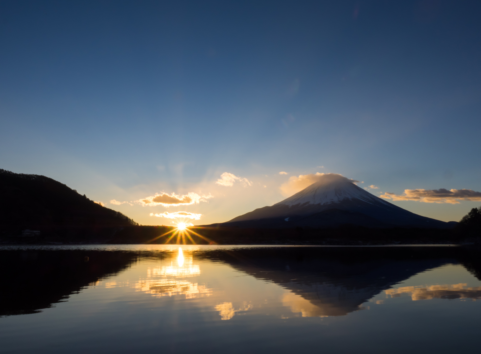 A new dawn: The sun rises by Mount Fuji one early morning in Japan. | ISTOCK