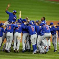 The Chicago Cubs celebrate after winning Game 7 of the World Series. | REUTERS