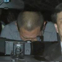 Former baseball great Kazuhiro Kiyohara is seen being taken to the Metropolitan Police Department headquarters after his arrest for drug possession. | KYODO