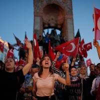 Supporters of President Recep Tayyip Erdogan rally in central Istanbul\'s Taksim Square on July 16 following a coup attempt. | AP
