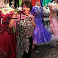Dancer Reina Takizawa displays a dress in her store. | KIT NAGAMURA