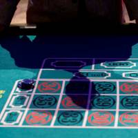 Knowing when to walk away: A visitor puts his hands on a mock casino roulette table at an international tourism promotion symposium in Tokyo in September 2013.  | REUTERS