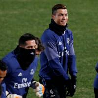Real Madrid\'s Cristiano Ronaldo (center) and teammates participate in a Saturday training session. | REUTERS