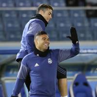 Real Madrid\'s Cristiano Ronaldo (top) and Casemiro joke around during a training session on Wednesday in Yokohama. | AP