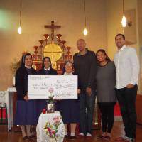 Toyama Grouses coach Bob Nash (third from right) attends a November event in honor of his late wife, Domelynne, with their children, Dr. Erika Nash Cameron and Bobby, at Toyama Catholic Church. | BOB NASH