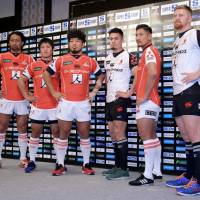 Members of the Sunwolves pose for photographs during a news conference on Monday. The team is set to begin the 2017 season on Feb. 25 against the Highlanders. | KAZ NAGATSUKA