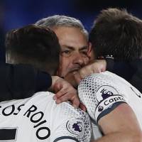 Manchester United manager Jose Mourinho celebrates with Michael Carrick (right) and Marcos Rojo after their win over Crystal Palace on Dec. 14. | REUTERS