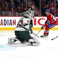 Montreal’s Max Pacioretty scores past Minnesota’s Devan Dubnyk on Thursday night. Blue Jackets rout Pens for 11th straight win