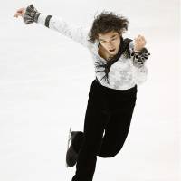 Takahito Mura skates during the men\'s short program at the All-Japan Championships on Friday in Kadoma, Osaka Prefecture. Mura is in first place with 90.34 points. | KYODO
