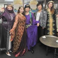 Kumiko Meric (second from right), the wife of Turkey\'s ambassador to Japan, and Japan-Turkish Womens Club members pose with people in traditional Turkish folk costumes at a celebration of Turkish culture, organized by the Japan-Turkish Womens Club, at Yunus Emre Institute in Tokyo on Nov. 27. | YOSHIAKI MIURA