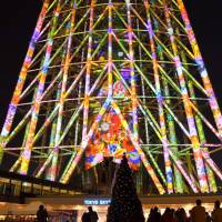 An image of flowers is projected on the lower part of the Tokyo Skytree in Tokyo\'s Sumida Ward on Thursday. The display is set to run through Dec. 25. | SATOKO KAWASAKI