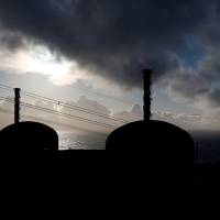 Nuclear Power Plant 1 and 2 units are silhouetted Nov. 16 at sunset in Flamanville, France. Areva is set to finish construction of EDF’s latest reactor in Flamanville, Normandy, in 2018 with a delay of nearly a decade. NRC plans to name U.S. nuclear reactors using potentially flawed Areva parts