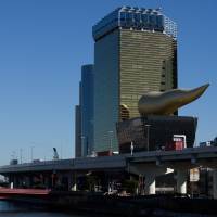 The Asahi Group Holdings Ltd. headquarters stands in Tokyo on Tuesday. | BLOOMBERG