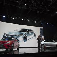 Akio Toyoda, president of Toyota Motor Corp., speaks at the 2017 North American International Auto Show (NAIAS) in Detroit on Monday. | BLOOMBERG