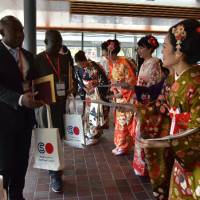 Kimono-clad women greet visitors at the ROHM Theatre Kyoto, the venue of the Kyoto Opening of the World Forum on Sport and Culture on Oct. 19. | OFFICE OF WORLD FORUM ON SPORT AND CULTURE
