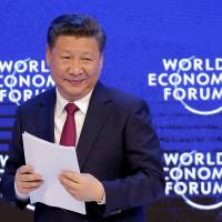 Chinese President Xi Jinping attends the World Economic Forum on Tuesday in Davos, Switzerland. | AP